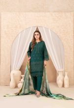 "Stylish bottle green kurti set with intricate lacework and multi-shade floral dupatta, paired with pointed silver heels."